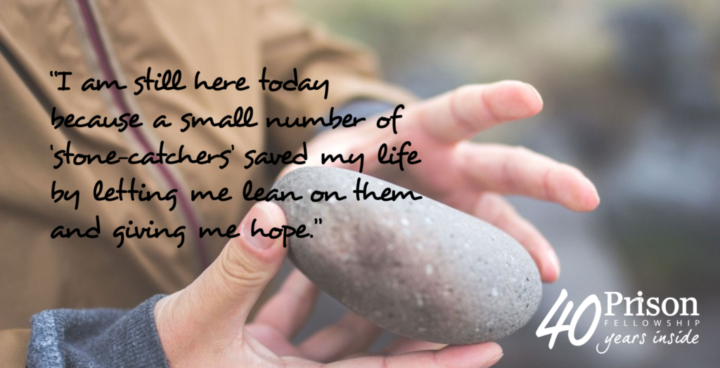 "I am still here today because a small number of 'stone-catchers' saved my life by letting me lean on them and giving me hope." - quote from Gavin against a background of someone holding a stone.